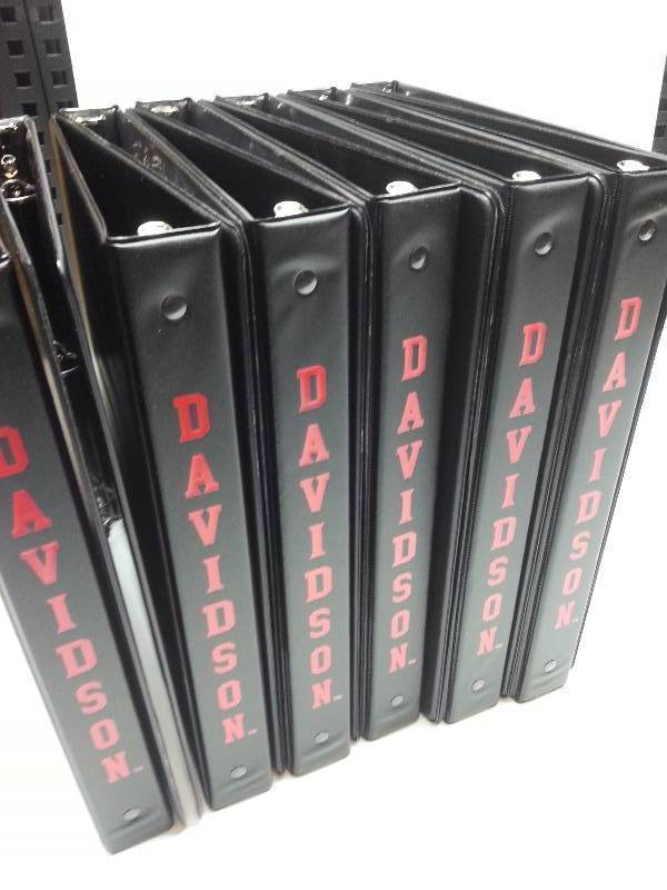 lot 9094 image: Full case of 12 standard 11 X 10 X 1 size 3 ring notebook binders with clear plastic insert places.