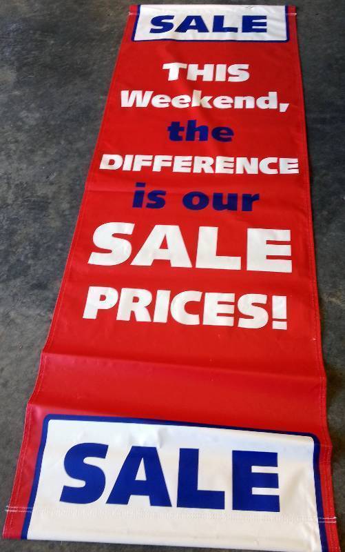 lot 9243-2 image: New 24 inch X 70 inch sewn vinyl SALE banner sign featuring hanging loops on the top and bottom.
