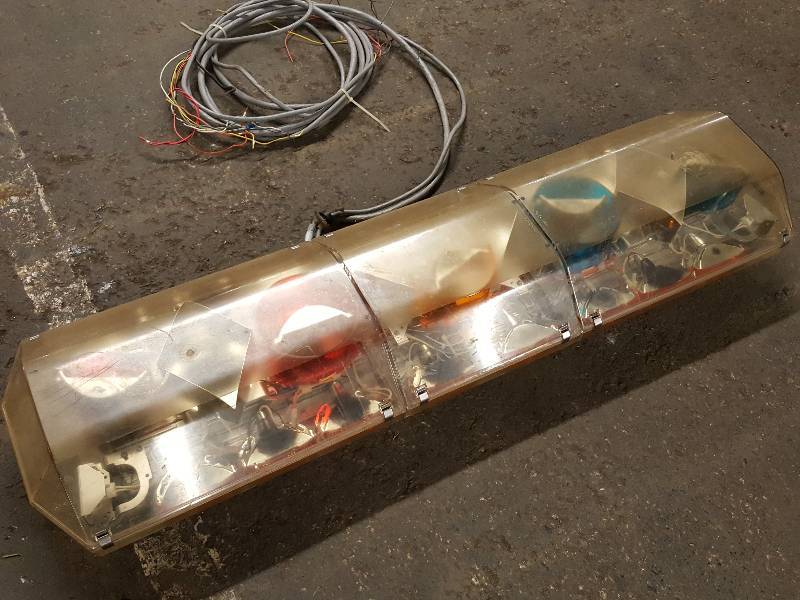 lot 8534 image: Wow play cops and robbers with this exotic emergency light bar.  I see only a slight crack