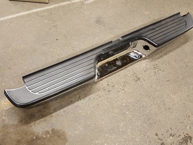 lot 8519 image: Its new and has a small ding on the bottom is this Chrome pick up or van rear bumper.