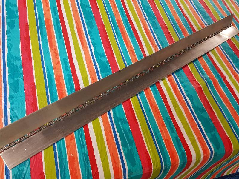 lot 8508 image: Never used aluminum piano 40 long hinge with 3 wide sides.  Tool box or toy box lid maybe