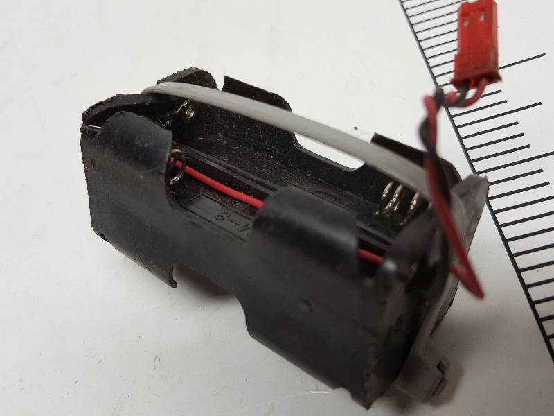 lot 8550 image: Battery pack for 4 of the AA series batteries.  No batteries and show a few cracks but would still fire it up