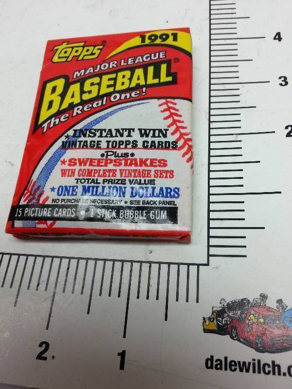 lot 8959 image: 1991 Topps MLB New old stock pack of 15 picture cards and a stick of Bubble Gum dont plan on much flavor left in the bubble gum