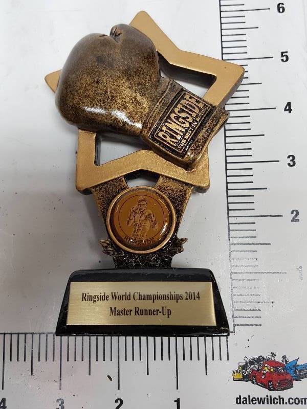 lot 9268 image: Award Trophy from the Combat Ringside auction a few weeks ago of the left over inventory.