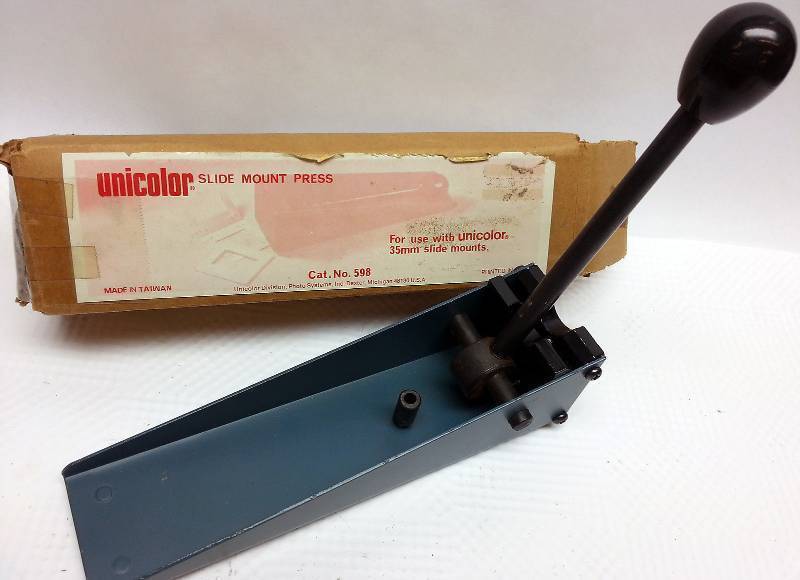 lot 9319 image: Made by Unicolor is this 35MM photography slides mounting press catalog # 598.