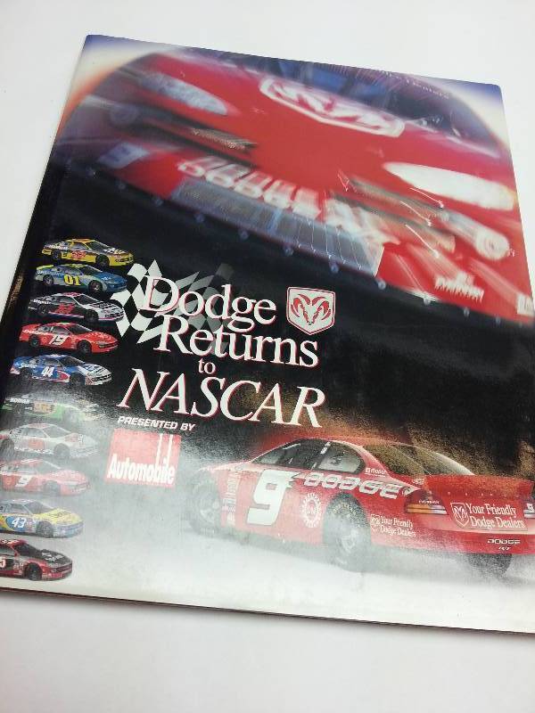 lot 9378 image: For you Mopar guys, a hard cover full color book featuring Dodge returns to NASCAR