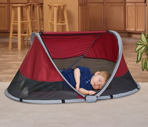 lot 51068 image: The KidCo� Peapod is a lightweight indooroutdoor travel bed for children 6 months to 3 years of age  Light weight at just 3 pounds, Cranberry, Midnight and Tangerine  (Tear in case)