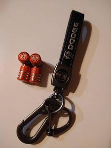 lot 4676 image: Black dodge replacement key chain with 4 red caps