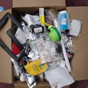 lot 9101 image: 16WX8HX22L MYSTERY BOX MASK , TOYS , SMALL PACKS OF SCREWS , PHONE CASES, HOLIDAY DECOR, AND MORE