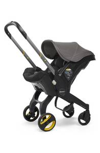 lot 10164 image: Doona Convertible Infant Car SeatCompact Stroller System with Base in Grey Hound Retail$550.99