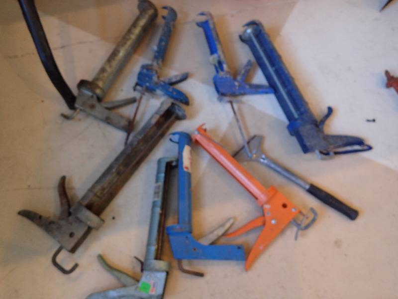 lot 1426 image: Large Lot Of Cawking Guns With Wood Scraper