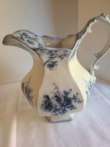 lot 1033 image: Flow Blue Doreen pitcher 12 tall, does have crack