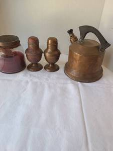 lot 1051 image: Copper tea kettle, salt and pepper shakers, candle
