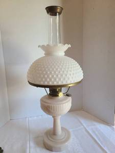 lot 1066 image: Antique Aladdin lamp hobnail milkglass top, Lincoln pattern base. Has moth protector on top. Comes with wick cleaner.