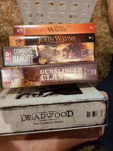lot 1221 image: DVDs and plastic storage basket