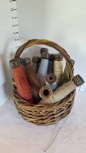 lot 1358 image: Wooden thread spools with basket