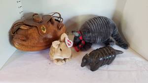 lot 1364 image: Armadillo purse, carved wooden and stuffed armadillos