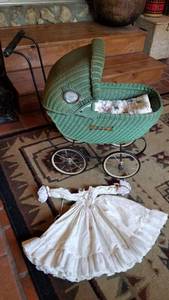 lot 1373 image: Vintage doll buggy approx 2 ft tall, doll quilt and dress