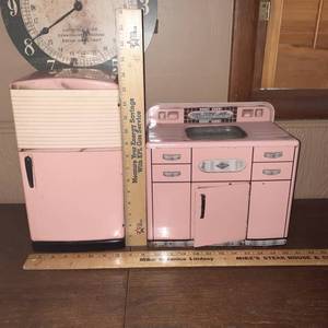 lot 1418 image: Childs vintage pink metal kitchen refrigerator and sink purchased from Sandi Gore Evans Studio (Augusta Ks.)