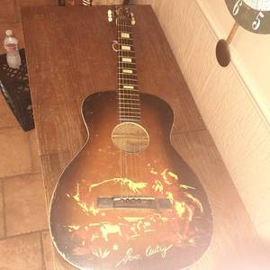 lot 1427 image: Vintage Gene Autry guitar with case