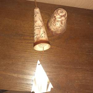 lot 1428 image: (2) Indian wind chimes. (1) doesnt have insides or rope for hanging