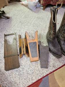 lot 2015 image: Boot jacks ( iron one on right missing a piece), and a pair of alligator boots for display