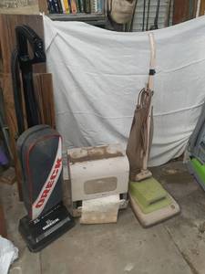 lot 3010 image: Vintage Hoover vacuum, paper towel dispenser, and an Oreck vacuum