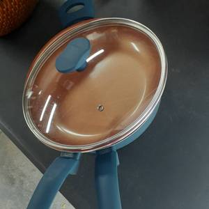 lot 3014 image: Kitchen ware. IKO. 4qt. pan and 11 inch skillet with matching lid.