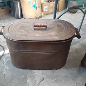 lot 3074 image: Brass ash can with lid. 14.5 x 27 x 13. The lid is dented. See pictures