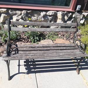 lot 4000 image: Wooden and wrought iron bench. Needs some TLC. 27 X 48 X 20