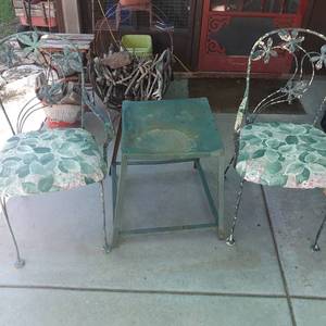 lot 4003 image: (2) Padded wrought iron chairs plus table. table is 20 x 17 x 18