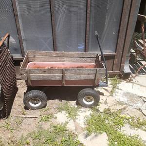 lot 4015 image: Little red wagon. Has a wooden framed added to it