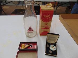 lot 1871 image: Milk Bottle, Pipe and Casino Token
