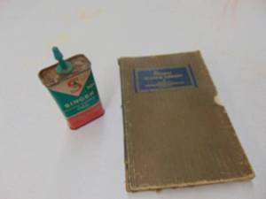 lot 1874 image: Singer Sewing Oil Can and more