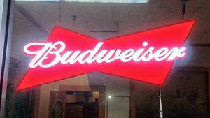 lot 140 image: BUDWEISER Beer Light Up Bowtie LED Sign - Perfect for Man Cave Powers On (38 W x 15 H)