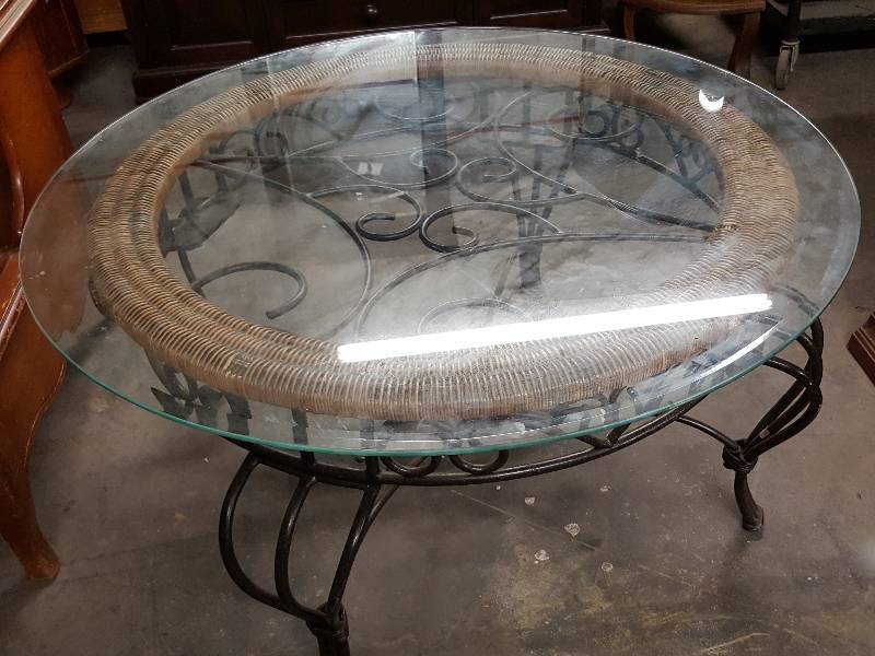 lot 1010 image: Nice piece here.  Glass top and wicker wrought iron style metal table with beveled glass top