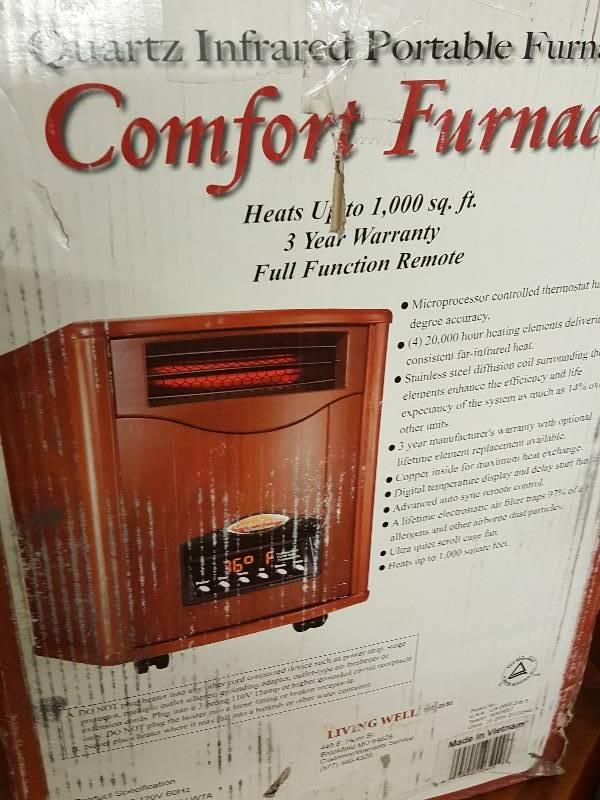lot 1015 image: Quartz Infrared portable furnace with a remote control.  This could be a money maker if youre handy.