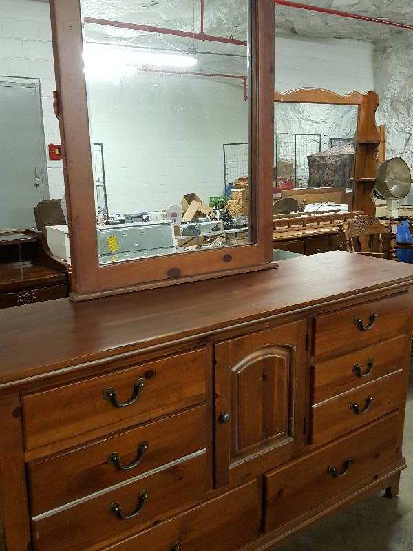 lot 1021 image: Real wood and very nice looking 66 wide X 18 deep Oxford Brown dresser with cool mirror.