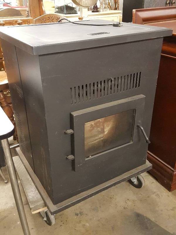 lot 1023 image: Serious heat here with this PelPro wood pellet Dansons MFG Company home heater with a fresh load of pellets ready for the winter