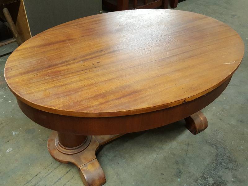lot 1050 image: 38 X 27 oval wood table with heavy legs and drawer