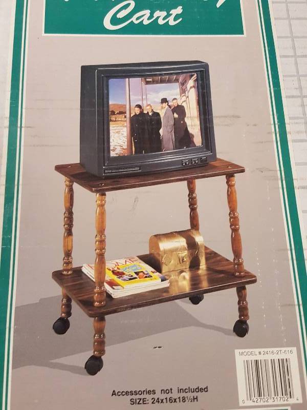 lot 1056 image: New in the sealed box is this TV in the kitchen utility cart with casters