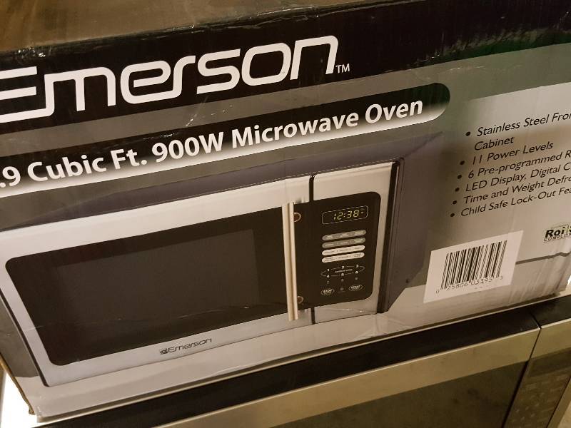 lot 1058 image: Emerson .9 CF 900 watt micro wave that has definitely been used.  Again, get the cleaning supplies Ethel, youre going to need em
