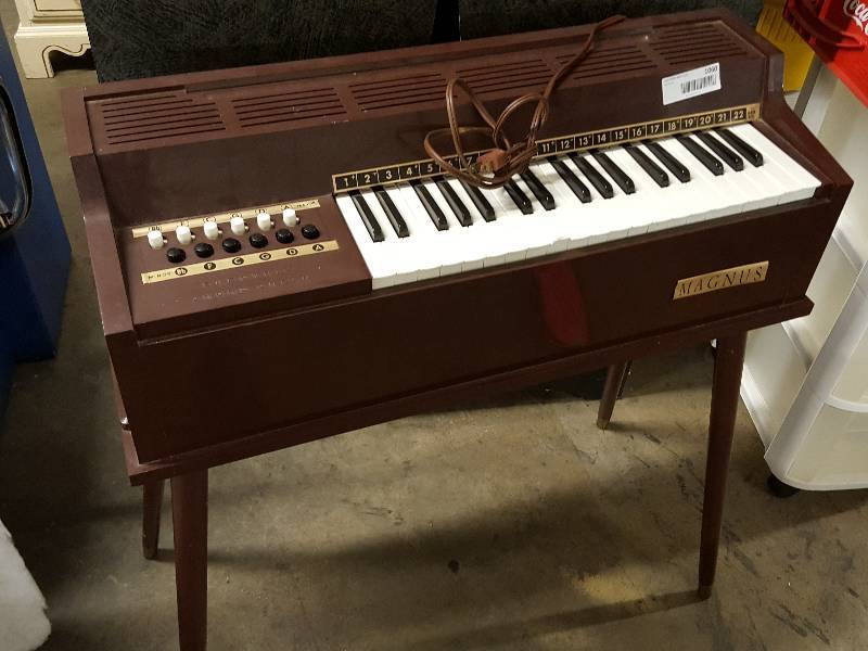 lot 1060 image: Magnus Brand electric cord organ.  Tested and works.  Have some fun, make some music with this.