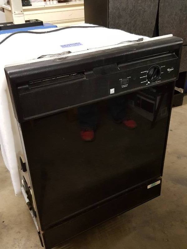 lot 1064 image: Black Whirlpool dishwasher not tested.  Was in storage so good chance is was in operating condition.