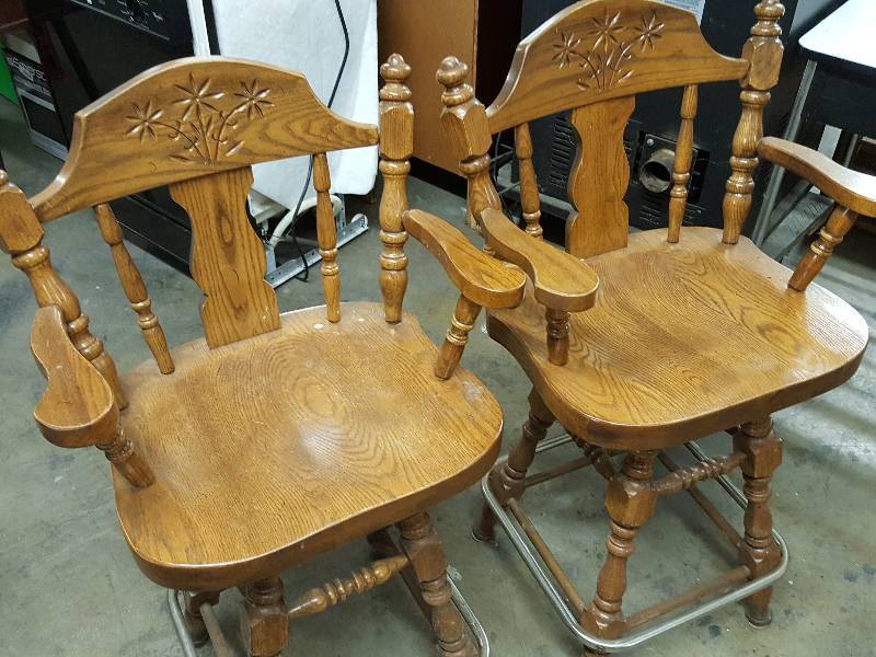 lot 1065 image: Nice quality pair of real wood bar stools with swivel tops with carving.