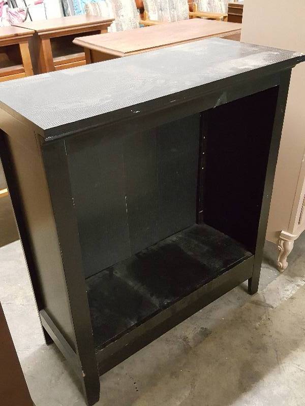lot 1072 image: Most likely a book case or display cabinet designed for shelves but no shelves included now.  Corner damage shown in the photo