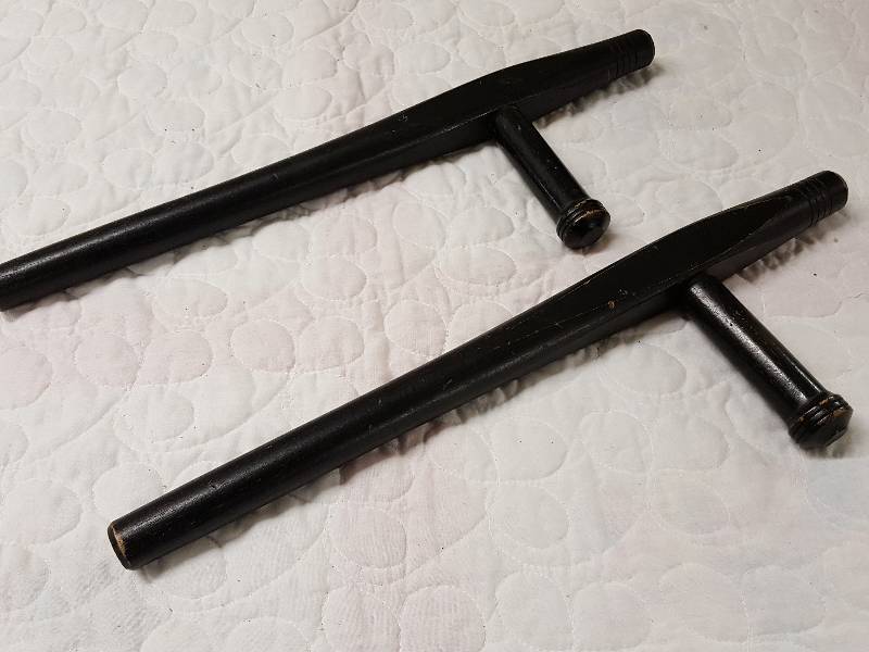 lot 1116 image: Pair of police wood batons with the thumping handle.  Bid high on the police belt and carry these 2 in it like guns