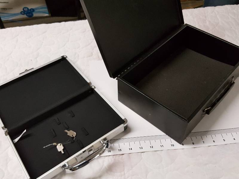 lot 1124 image: Pair of storage boxes the Black one being a Honeywell fire retardant documents box with the lock keys
