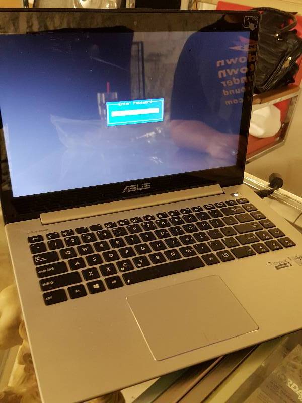lot 1126 image: Good looking ASUS lap top that powers up real nice but no body knows the user password.