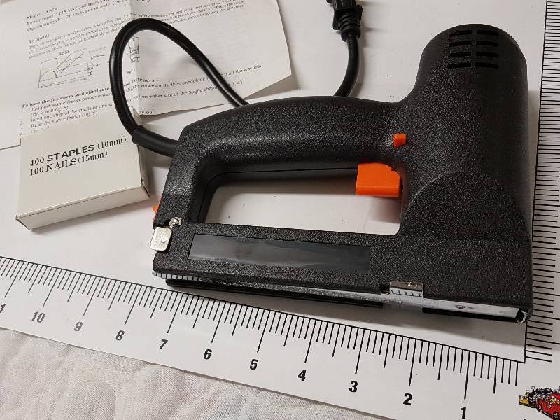 lot 1127 image: New in the box is this Master Craft Stapler Nail Gun Model A688 and a starter box of staples